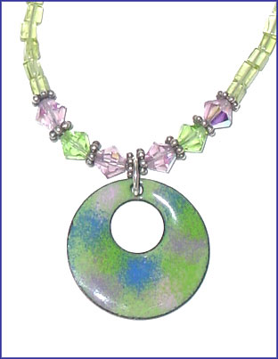 Peridot and green enameled pendant